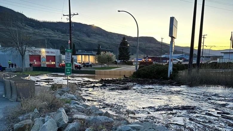 High water levels in Cache Creek have seen residents of one property ordered to evacuate as the village declared a local state of emergency over flooding on April 30, 2023. Water flows through a low-lying area of the town here on April 29, 2023.