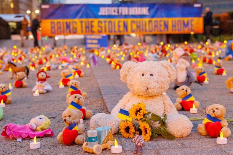 Avaaz members and Ukrainian refugees install thousands of kids' teddy bears and toys at Schuman Roundabout in front of the European Commission to highlight the reported abduction of thousands of Ukrainian children by Russia on Thursday, Feb. 23, 2022 in Brussels.