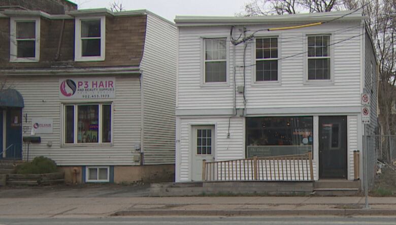 The storefronts of Coastal Cafe and P3 Hair and Beauty Supplies are seen in this photo. 