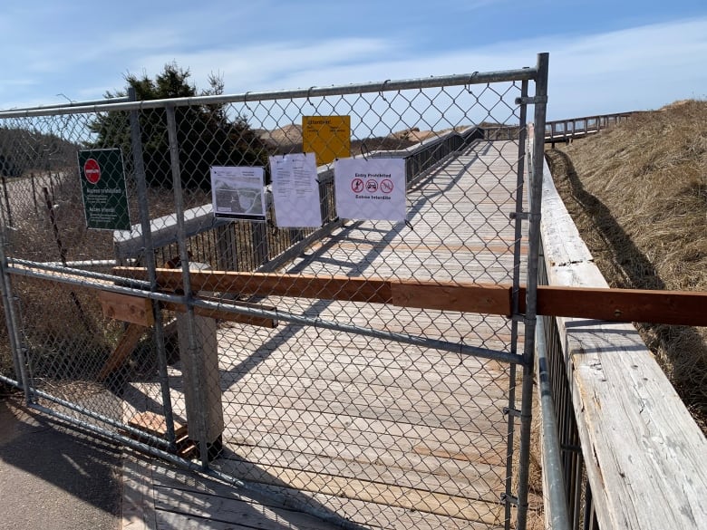 A gate blocks off access to Brackley Beach