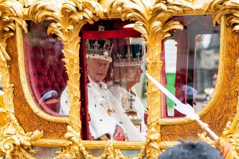 The King and Queen in a carriage.