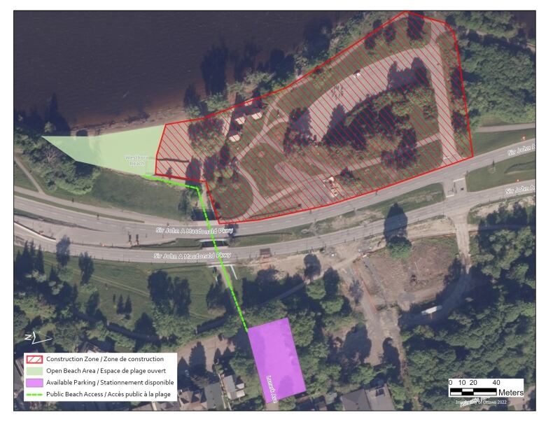 An overhead map of a stretch of land near a river, with a large part marked in red and a smaller section in green.