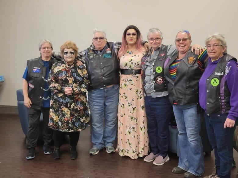 Patricia Glenn stands with other members of the motorcycle group, WindSisters, along with with drag queens, Von Panico (left) and Miss Lita (right). 