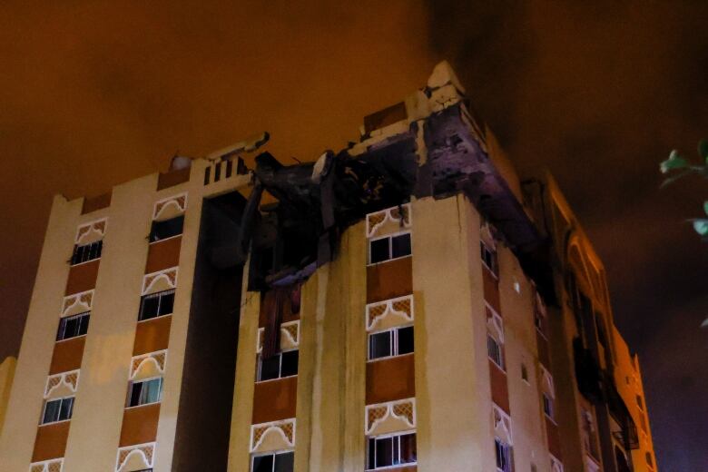 A building damaged by an Israeli airstrike is seen in the southern Gaza Strip.