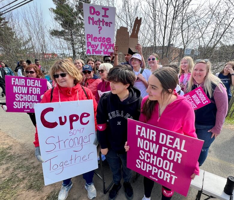 Auburn Drive High School joining Cole Harbour District High School on the picket lines holding pink signs and earing pink clothes.  