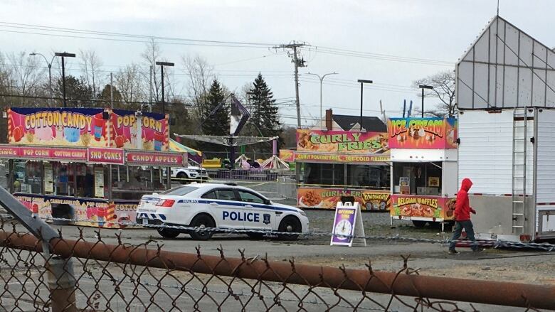 Police are shown at the scene of a stabbing at a fair ground