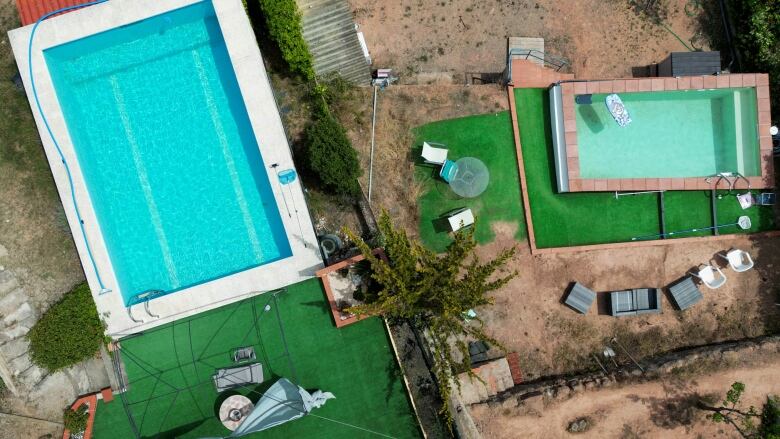 An aerial view shows swimming pools at neighbouring houses in Vacarisses, Spain.