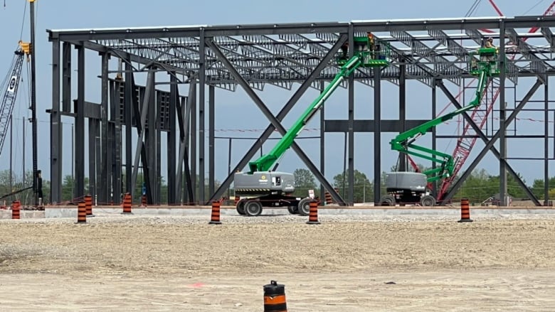 A crane near the frame of a metal building