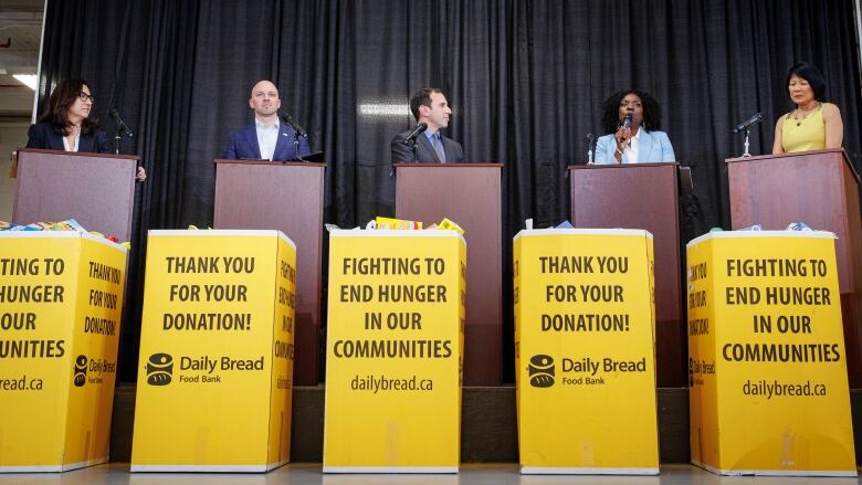 From left, Toronto mayoral candidates Ana Bailo, Brad Bradford, Josh Matlow, Mitzie Hunter and Olivia Chow take part in a debate on May 15, 2023.