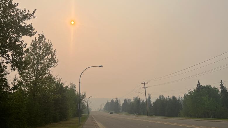 Hazy skies over a road.