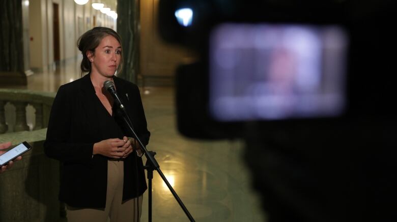 Saskatchewan NDP MLA Aleana Young speaks with media at the provincial legislature on May 15, 2023. 