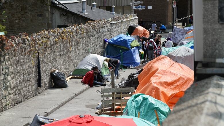 tents lined up on laneway