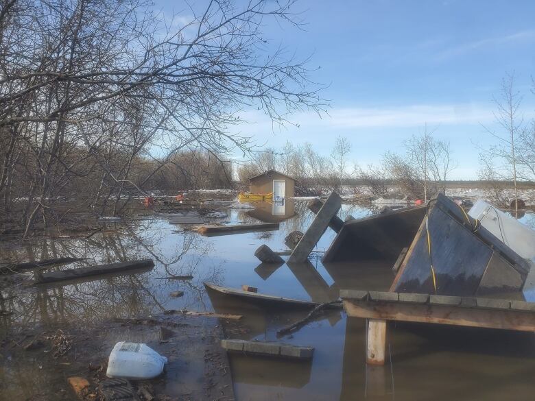 Cabins overturned in water.