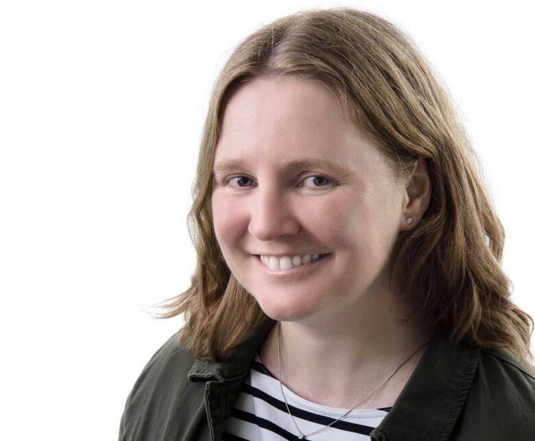 A woman poses for a portrait.