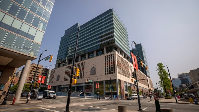 A tall office building rises from the base of Vancouver's former post office.