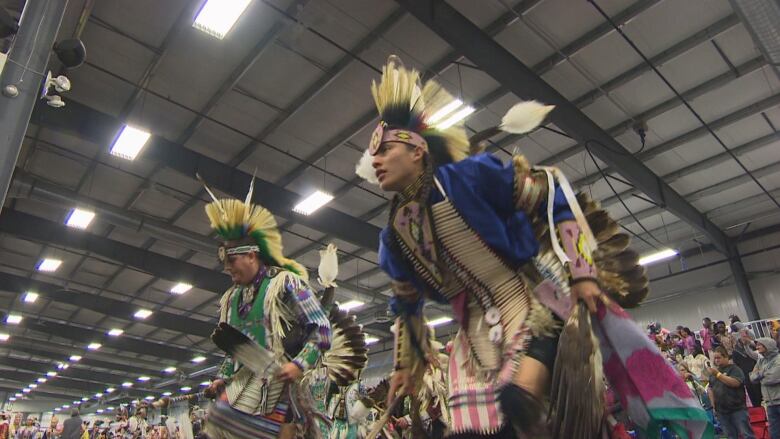 Powwow dancers are pictured