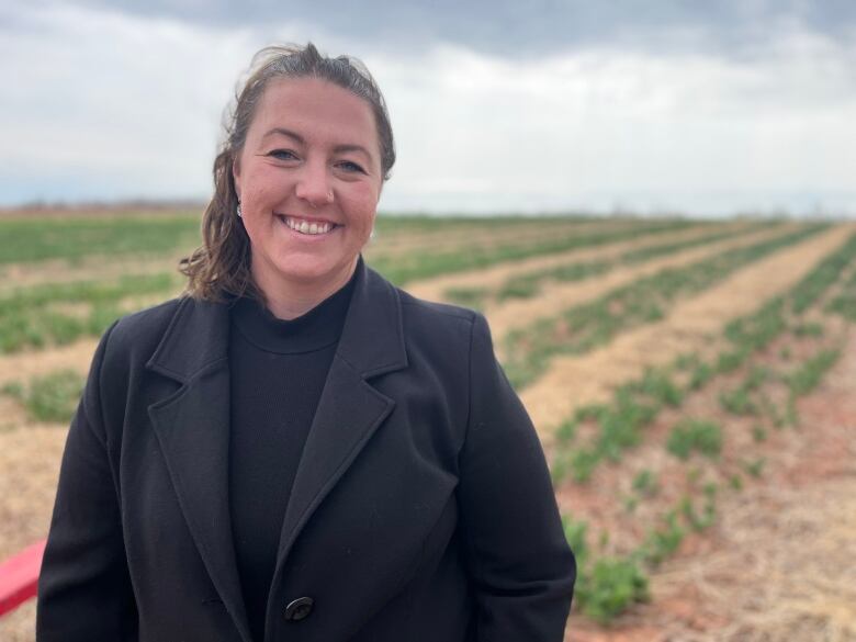 Trisha Viaene in front of her tulip crop in Belfast.