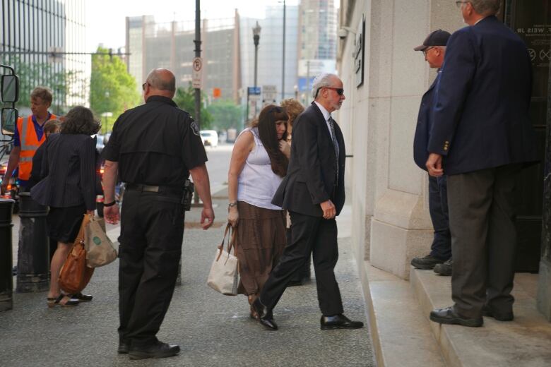 A man walks into a courthouse.