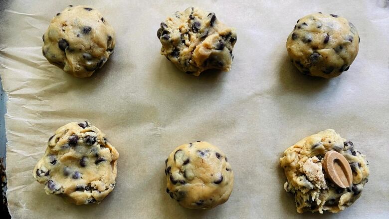 Cookie dough sits on a tray.