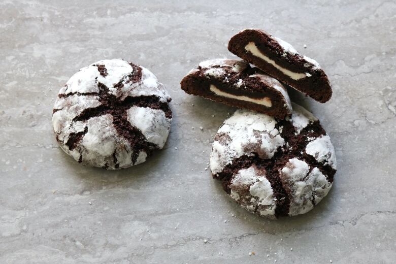 Chocolate-mint stuffed cookies sit in a pile.