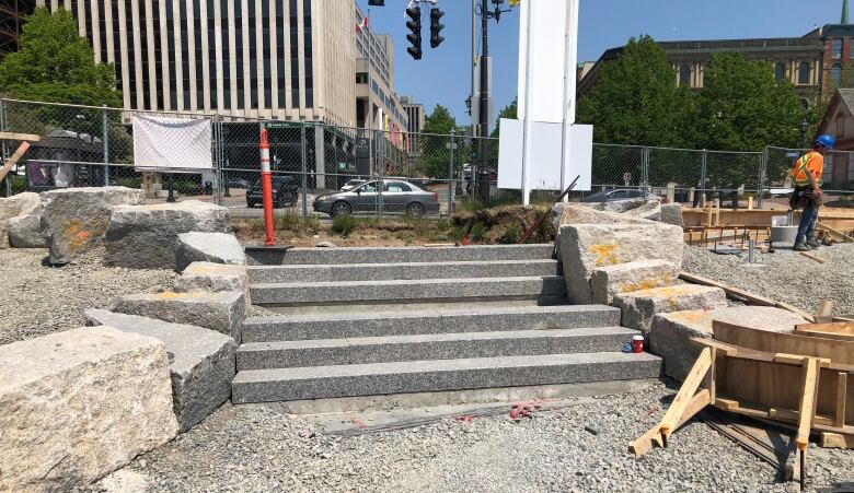 Granite steps leading into a construction zone. 