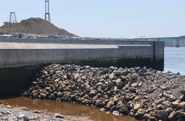 A cement seawall on the waterfront. 