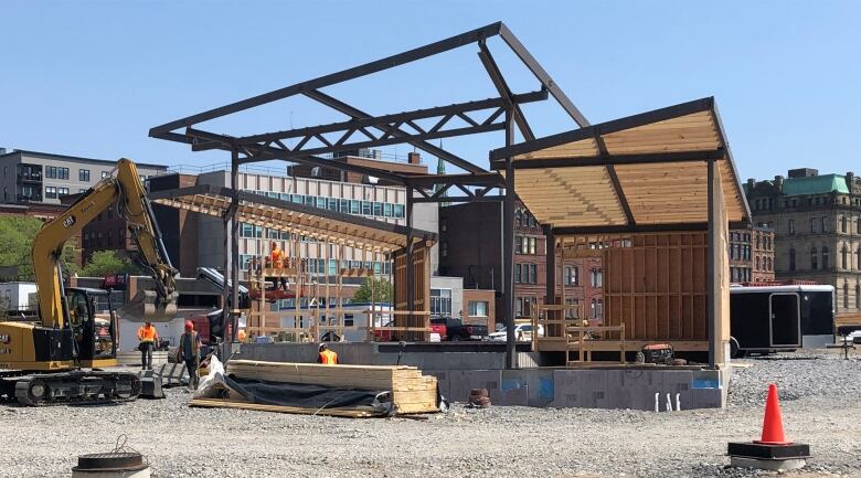 A covered bandstand under construction.