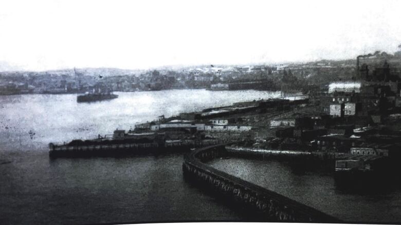 A black and white photo of the city of Saint John pictured looking east from the west side. 