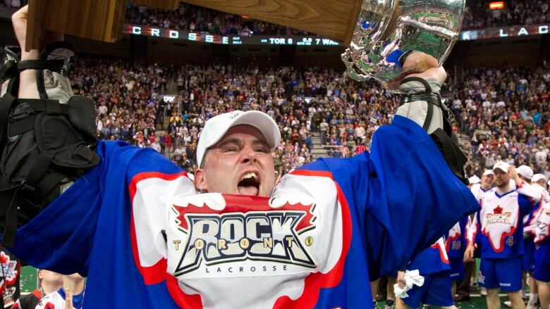 In this May 15, 2011 file photo, Toronto Rock goaltender Bob Watson hoists the National Lacrosse League trophy after defeating the Washinton Stealth in Toronto.