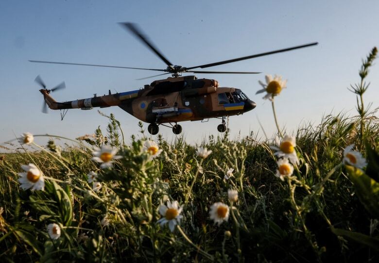 A Ukrainian military helicopter is seen flying in the northern part of the country.