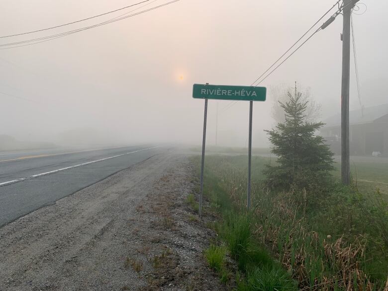 a road with a sign reading 