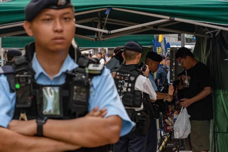 Police search a person's bag.