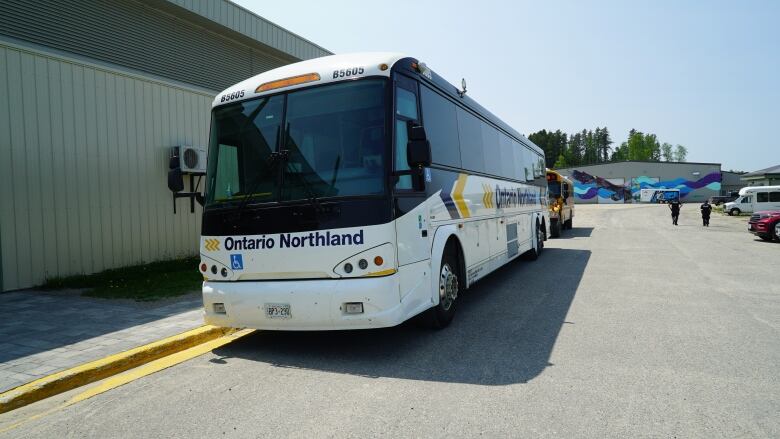 A large bus in a parking lot.