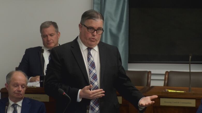 PC MLA Steven Myers stands in front of the P.E.I. legislature to answer questions from the opposition. 