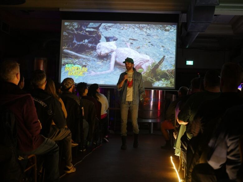 Ian Matheson speaks to a sold-out crowd before a screening of Transformers: The Movie at the Propeller Arcade on Gottingen Street, a former home of Wormwood's Dog and Monkey Cinema.