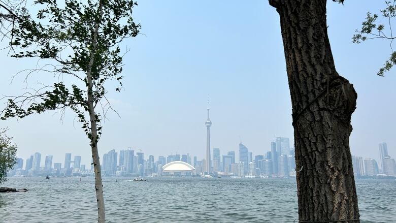 Forest fire smoke covers Toronto on June 6, 2023. See view across lake to Toronto skyline from the island on 06 Jun 2023.