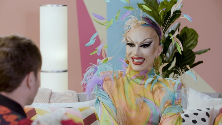 Drag queen Sasha Velour sits on the set of Here & Queer.