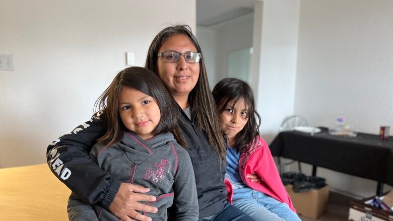 a woman and two girls