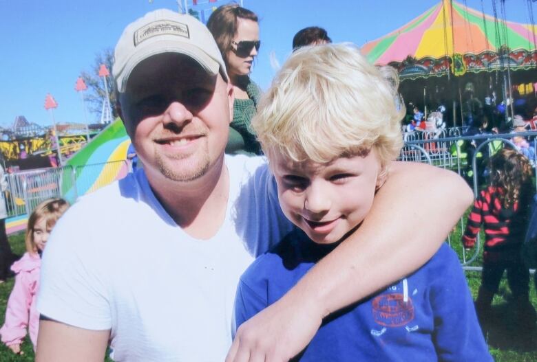 Then six-year-old Aidan Tate and his father Phil at a fall fair in Norwood, Ontario in Oct. 2010. Aidan's family hopes that people will remember him for how he lived, rather than how he died. 