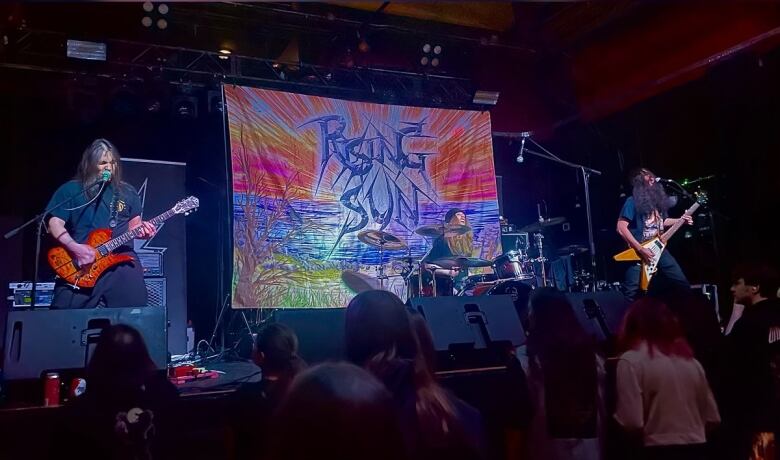 Kai Sakaguchi, left, performing with his thrash heavy metal band, Rising Sun. Kyo started the group months after his mother died after a three year struggle with ALS. 