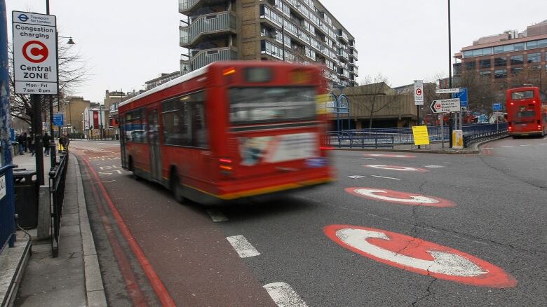 Bus entering congestion charging zone in London.