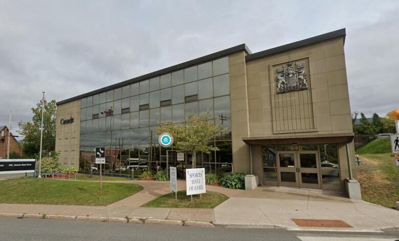 Exterior view of concrete building with hall of fame sign in front.