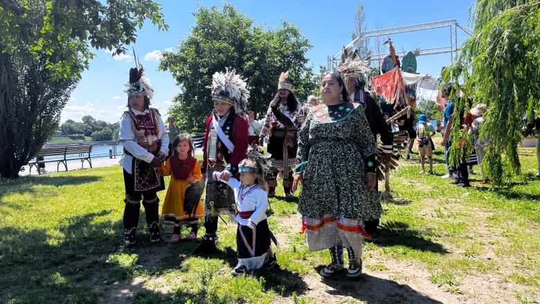 Women and children wearing regalia during a solstice ceremony in Montreal 