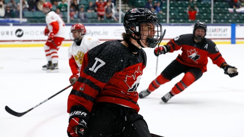 A hockey player celebrates.