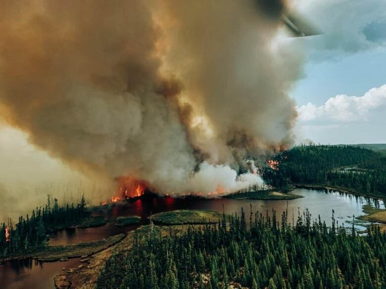 An aerial shot of fires burning near a lake in northern Quebec. 