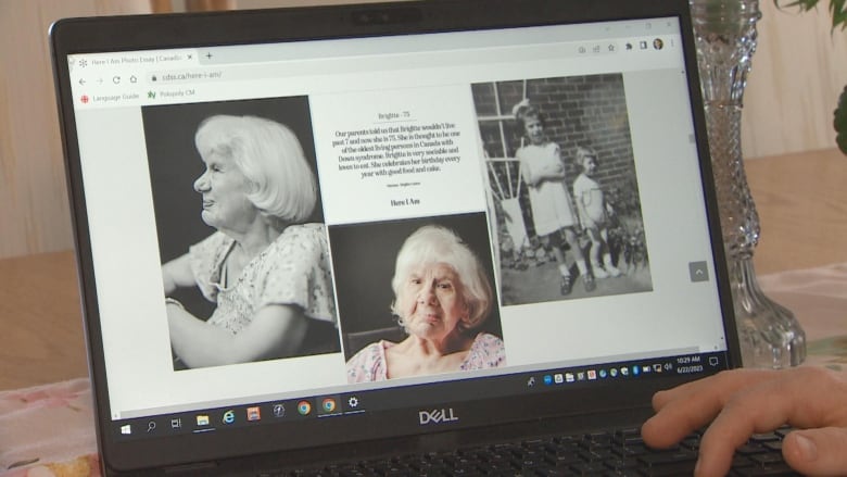 A laptop screen displays photos of an older woman looking thoughtfully at the camera. 