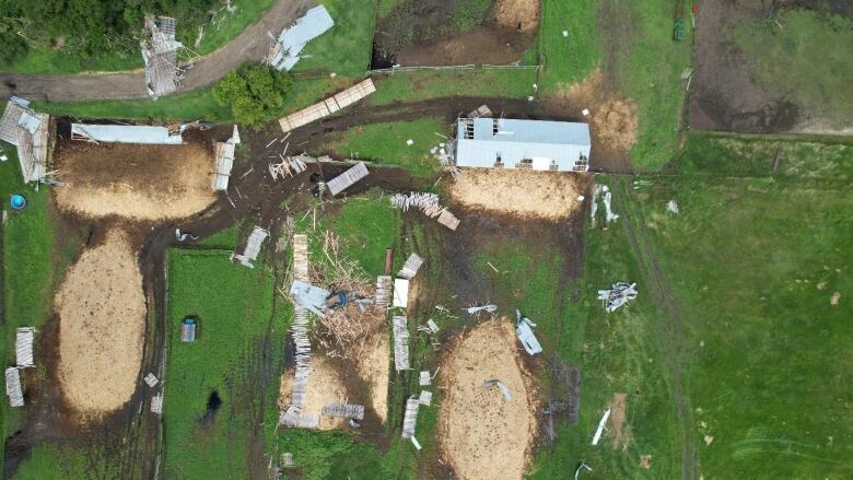 Bird's eye view of damage to a farm property after a tornado.