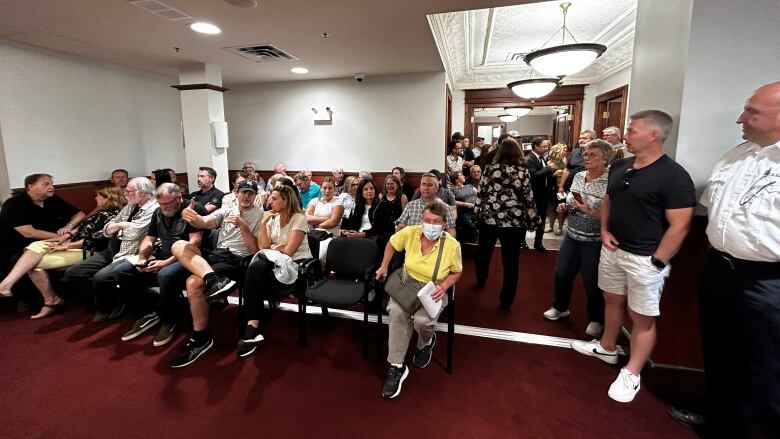 Over 60 people crammed into the chamber at city hall, with some standing in the hallway and filling a nearby media room.