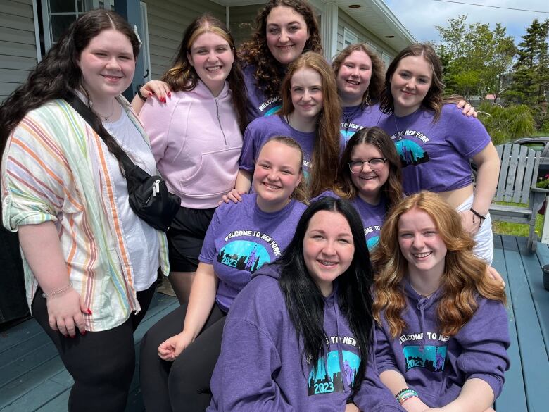 a group of young females pose for a photo 