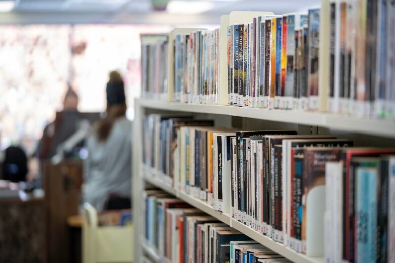 A bookshelf in a library